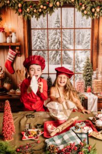 Kinderen tijdens een gezellige kerstfotoshoot in de bakkerijset in Almere