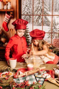 Kinderen tijdens een gezellige kerstfotoshoot in de bakkerijset in Almere